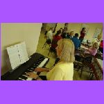 Cheryle at Piano - Her New Present.jpg